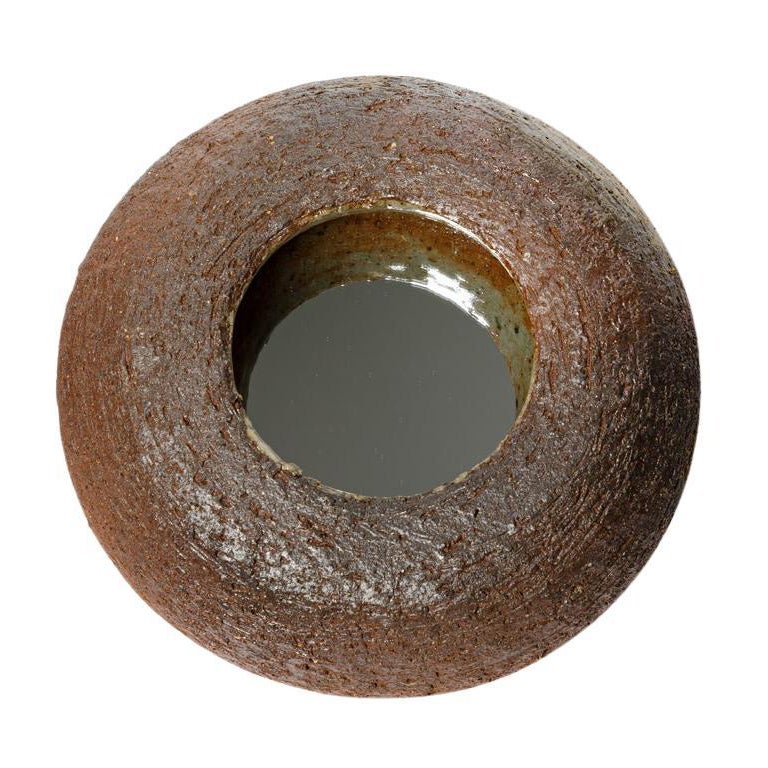 Wood fired ceramic mirror by Mia Jensen, 2025.