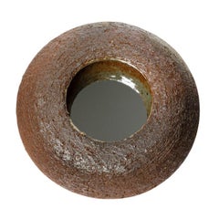 Wood fired ceramic mirror by Mia Jensen, 2025.