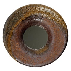 Wood fired ceramic mirror by Mia Jensen, 2025.
