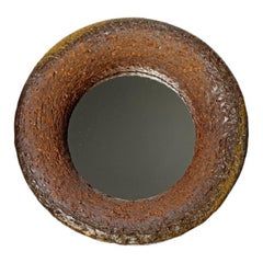Wood fired ceramic mirror by Mia Jensen, 2025.