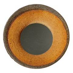 Wood fired ceramic mirror by Mia Jensen, 2025.