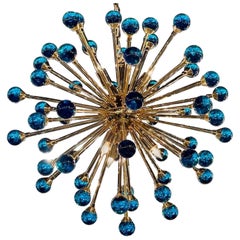 Araña moderna de cristal de Murano azul eléctrico y latón