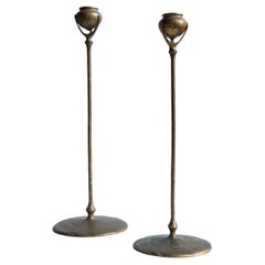 A matched pair of Tiffany Studios Etruscan bronze Candlesticks