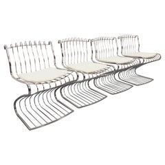 Suite de 4 chaises italiennes vintage Gastone Rinaldi en métal chromé et galette