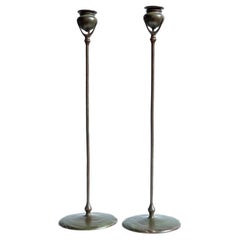 A pair of Tiffany Studios Etruscan bronze Candlesticks