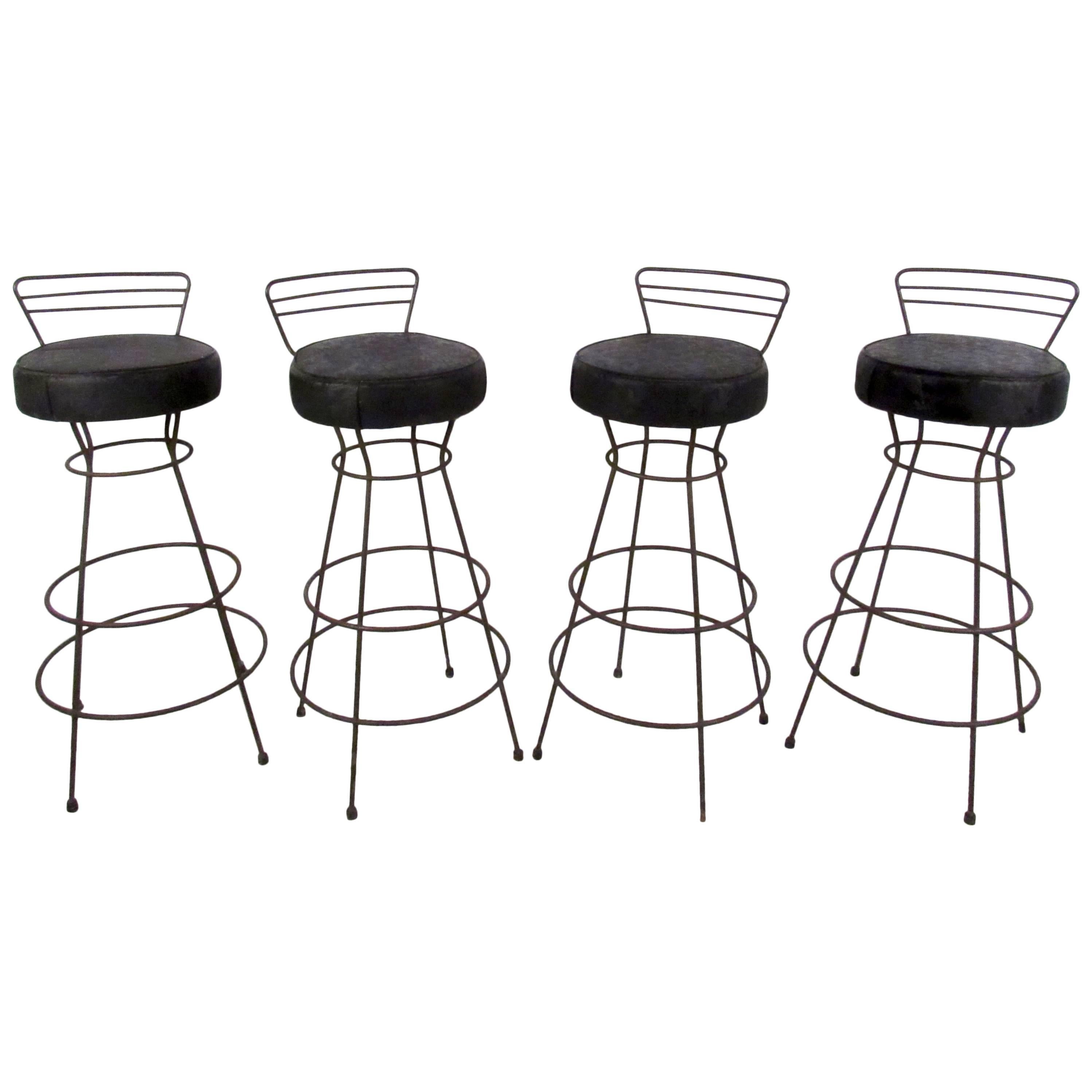 Four Mid-Century Iron and Vinyl Swivel Stools For Sale