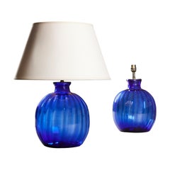 A Pair Of Gadrooned Blue Glass Lamps