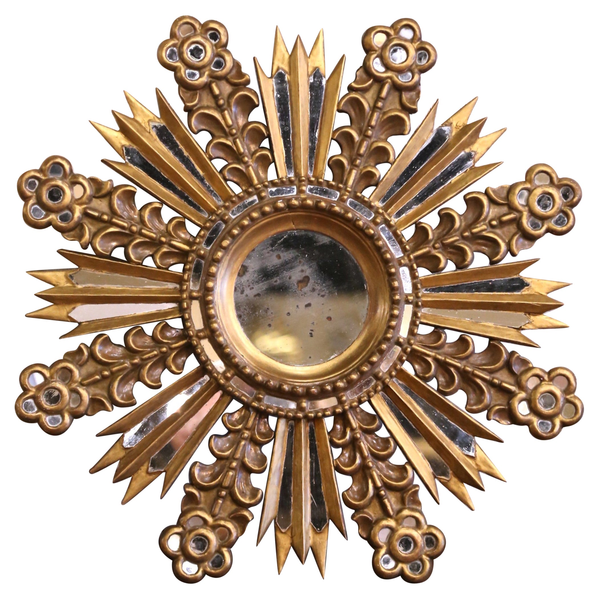 Miroir mural Sunburst espagnol du début du 20e siècle en bois doré avec inserts miroirs en vente