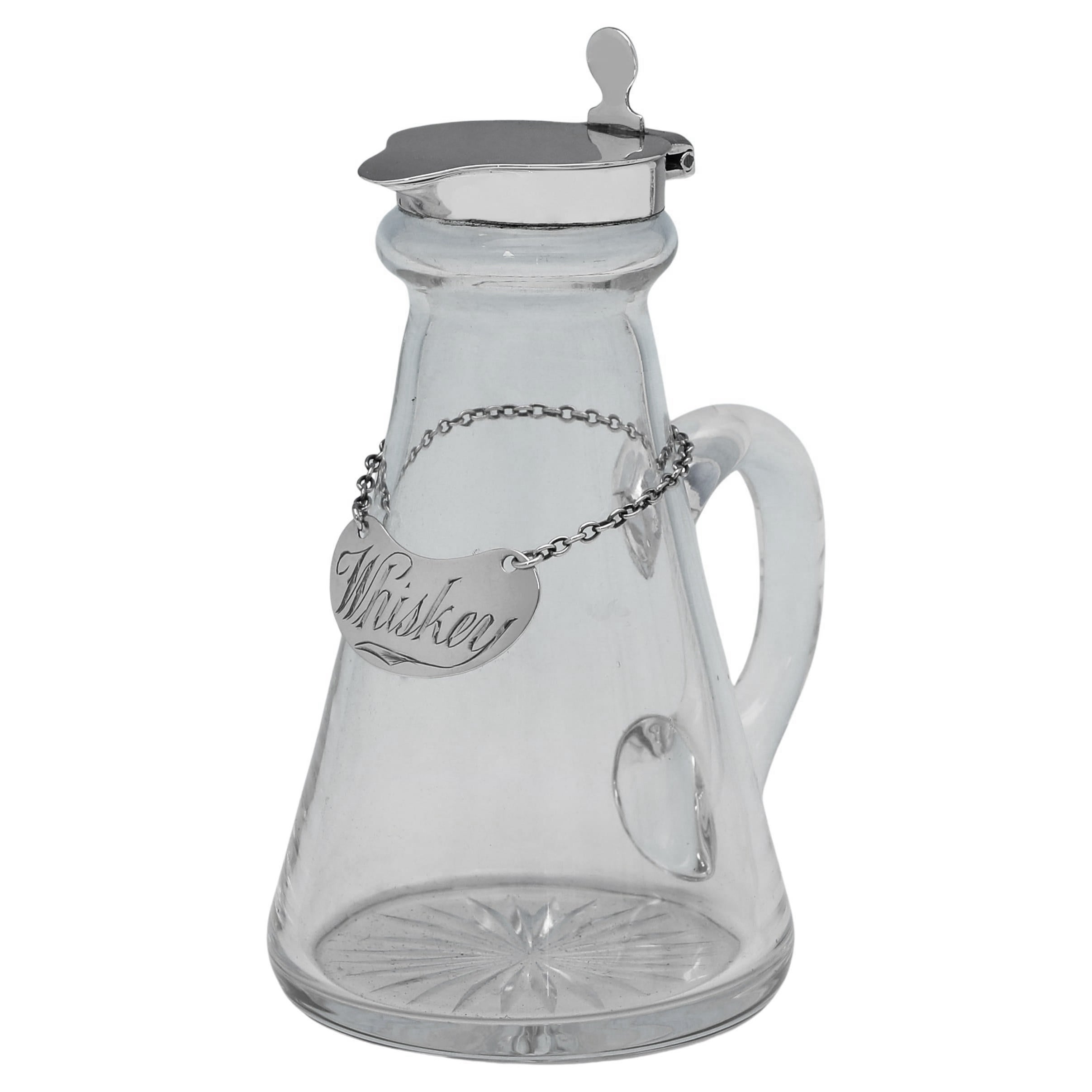 Pica de whisky o chota de plata de ley y cristal fabricada en 1927