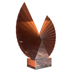 A large smoked glass and chrome sculpture by Runstadler Studios, signed, 1990
