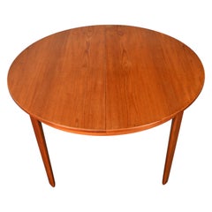Round Danish Modern Expandable Teak Dining Table With Two Leaves