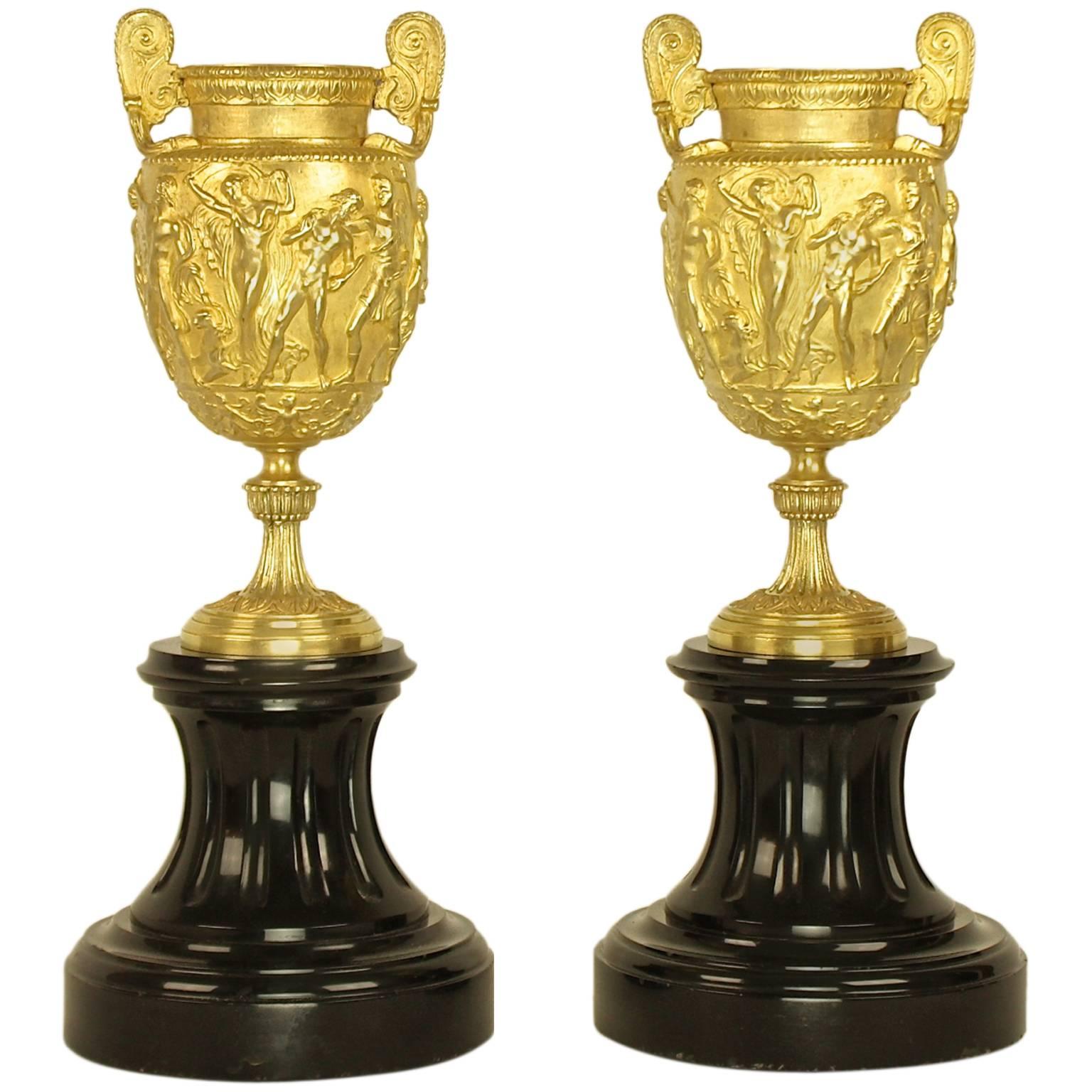 Pair of French Charles X Neoclassical Bacchanal Gilt Bronze Black Marble Urns