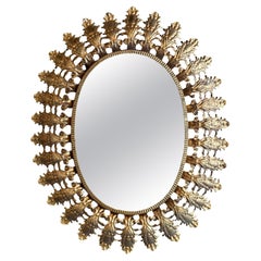 Espejo Ovalado Sunburst de Metal Dorado Español
