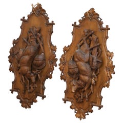 Pair of 19th Century Swiss Black Forest Carved Walnut Hunt Trophy Sculptures