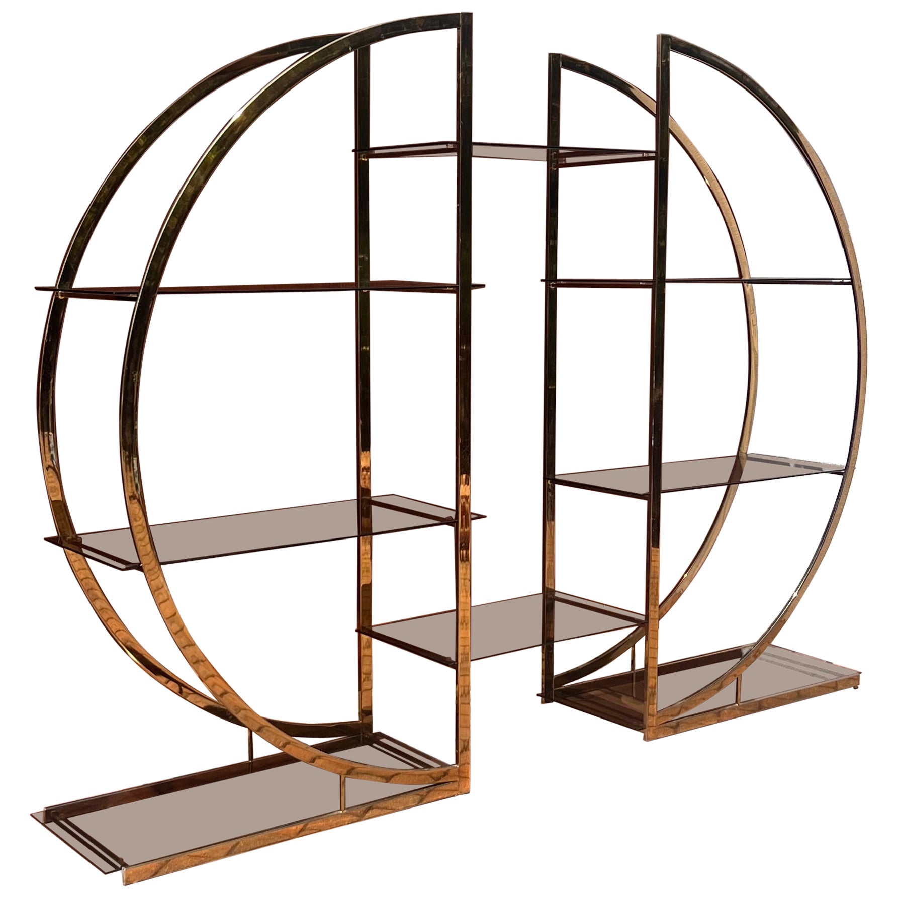 A mid century brass and smoked glass étagère, circa 1970