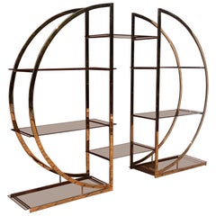 A mid century brass and smoked glass étagère, circa 1970
