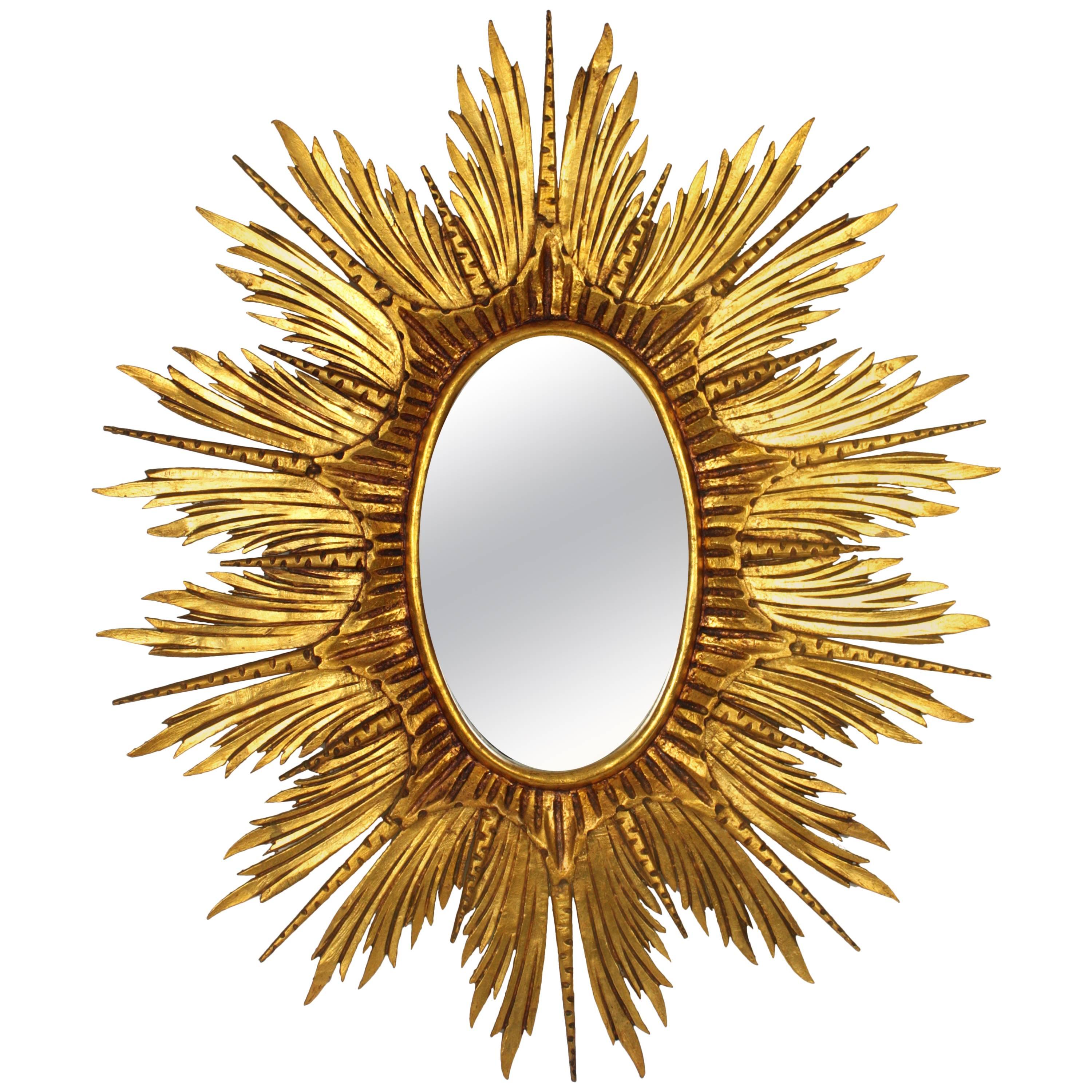 Large Spanish Carved Giltwood Sunburst or Starburst Oval Mirror