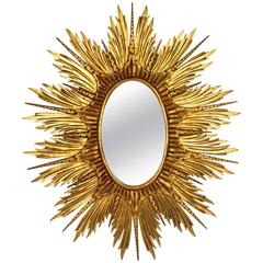 Vintage Large Spanish Carved Giltwood Sunburst or Starburst Oval Mirror