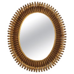 Großer ovaler Sunburst-Spiegel aus vergoldetem Schmiedeeisen, Wimpern-Design, 1950er Jahre