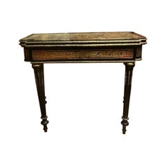 Boulle style game table in ebonized wood and gilded decorations, France