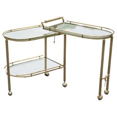 Italian Hollywood Regency Brass and Glass Three Tier Pivoting or Swivel Bar Cart