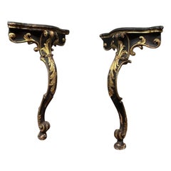 Pair of wooden consoles, corner shelves, lacquered with gold decorations, Italy
