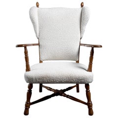 Elegant Danish Early 20th Century Oak Wingback Armchair with Bouclé Upholstery