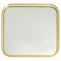 Mid Century Modern wall mirror with heavy brass frame by Münchener Zierspiegel