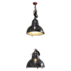 A pair of original, french industrial lamps, restored, ca. 1040s