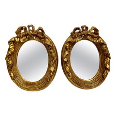 Pair of Vintage Gilt Bow Top Mirrors