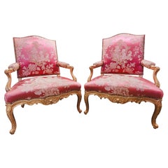 A fine pair of large 19th century French Louis XV gilt carved armchairs