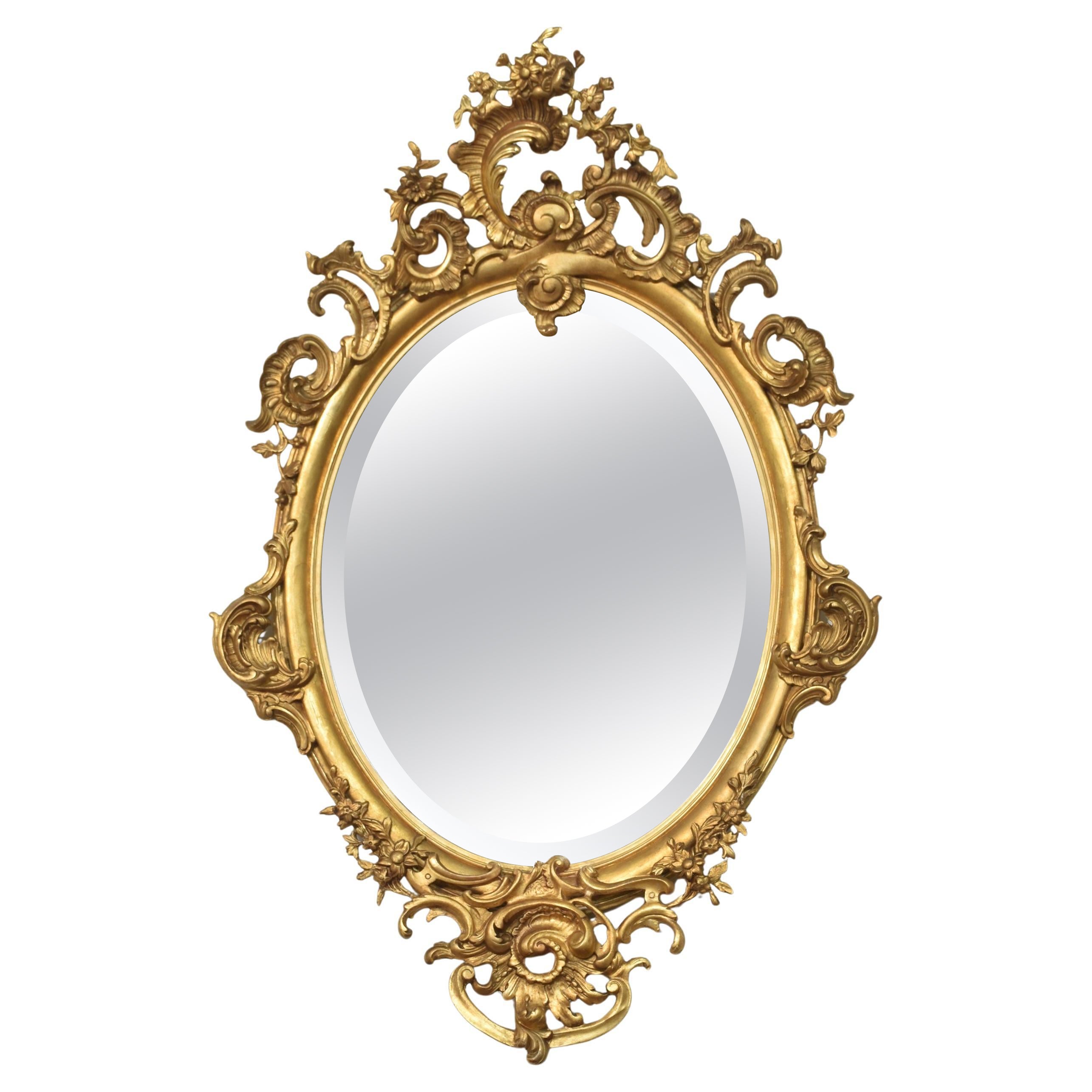 Carved gilt-wood oval wall mirror