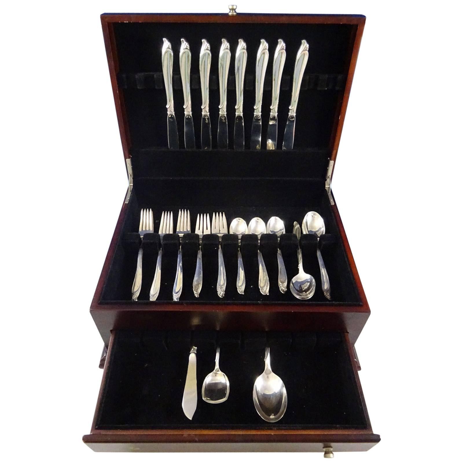 Mid-Century Modern sculptured beauty by International sterling silver flatware set of 43 pieces. This set includes:

Eight knives, 9 1/4