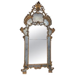 Mantelpiece mirror in richly carved and gilded wood, Italy