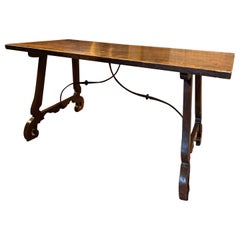 Walnut refectory table with wavy legs, Spain