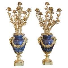 A fine pair of French gilt bronze and marble Louis XV candelabras
