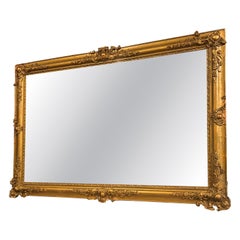 Miroir rectangulaire en bois doré et sculpté, Italie