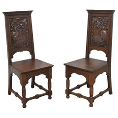Pair of carved oak hall chairs