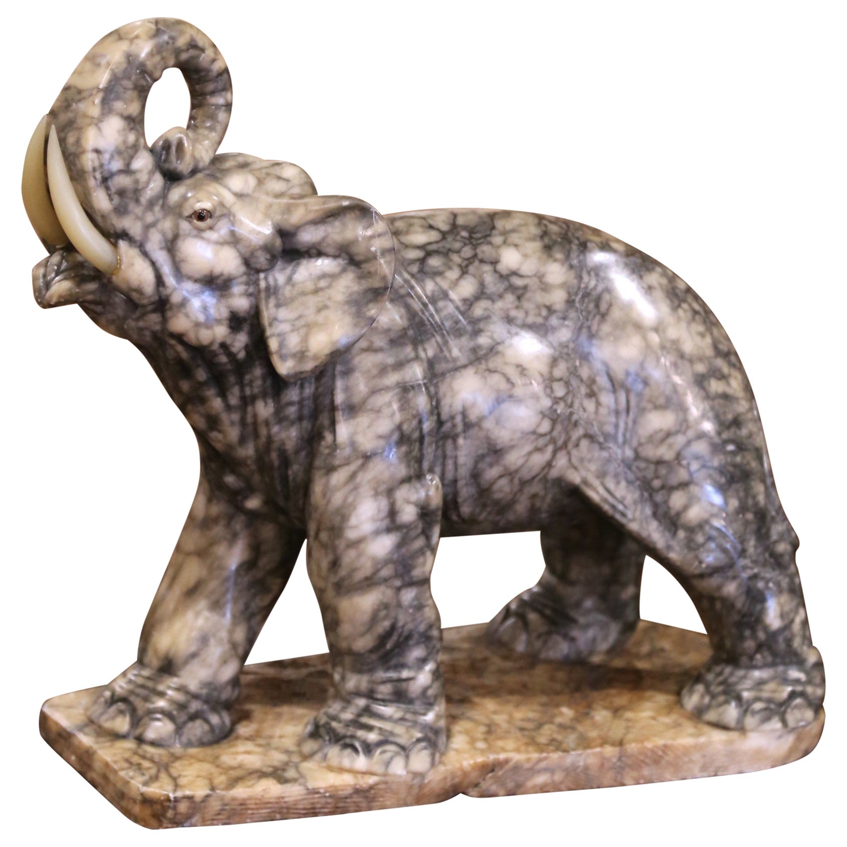 19th Century French Carved Variegated Marble Elephant with Raised Trunk in vendita