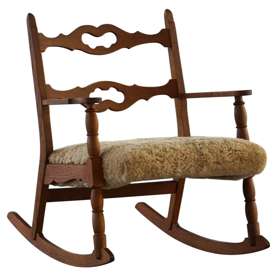 Henning Kjærnulf, Rocking Chair in Oak, Seat Reupholstered in Lambswool, 1960s