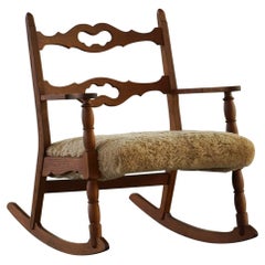 Henning Kjærnulf, Rocking Chair in Oak, Seat Reupholstered in Lambswool, 1960s