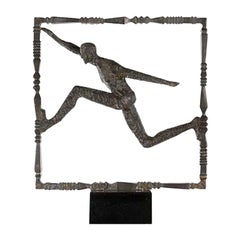 Sculpture of a Iron Running Man on Black Marble Base