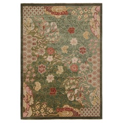 Rug & Kilim’s Chinese Style Art Deco rug in Green with Red & Gold Florals