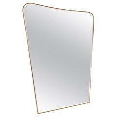 A large Italian brass & bevelled glass mirror
