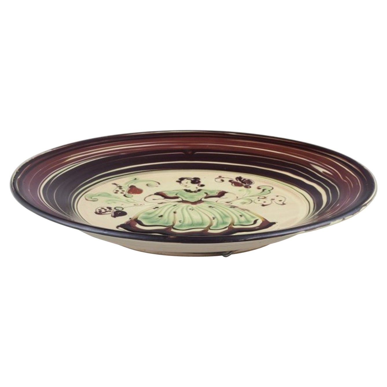 Kähler, Denmark. Large ceramic dish with motif of a dancing woman.
