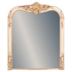 A French Louis XV style painted and gilt mirror, 19th C.