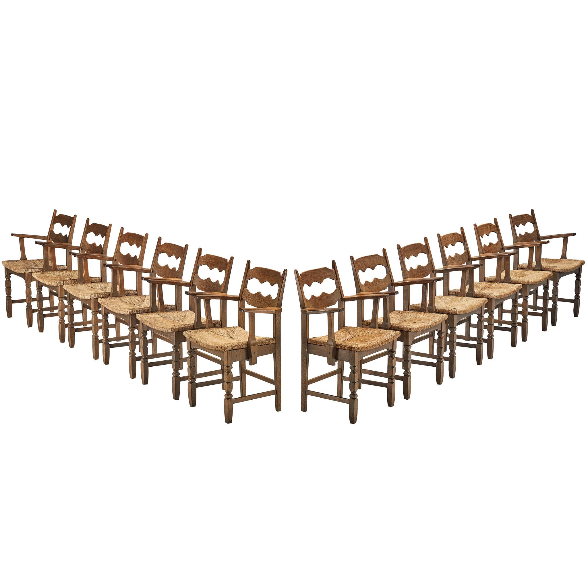 Set of Twelve Rustic Mid-Century Carved Armchairs in Oak and Straw For Sale