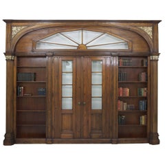 Large Antique Architectural Pass-Through with Bookcases Flanking Two Entry Doors
