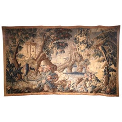 Tapiz de Aubusson francés tejido a mano del s. XVIII con pájaros, ruinas y borde floral