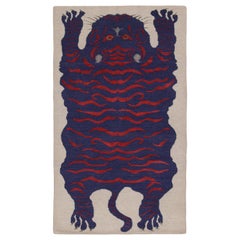 Rug & Kilim’s Tiger-Skin Rug in White with Blue & Red Pictorial